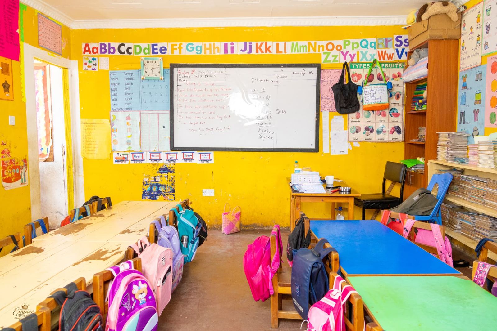 A cheerful classroom with the alphabet, polite words and the Story of Jonah on the whiteboard