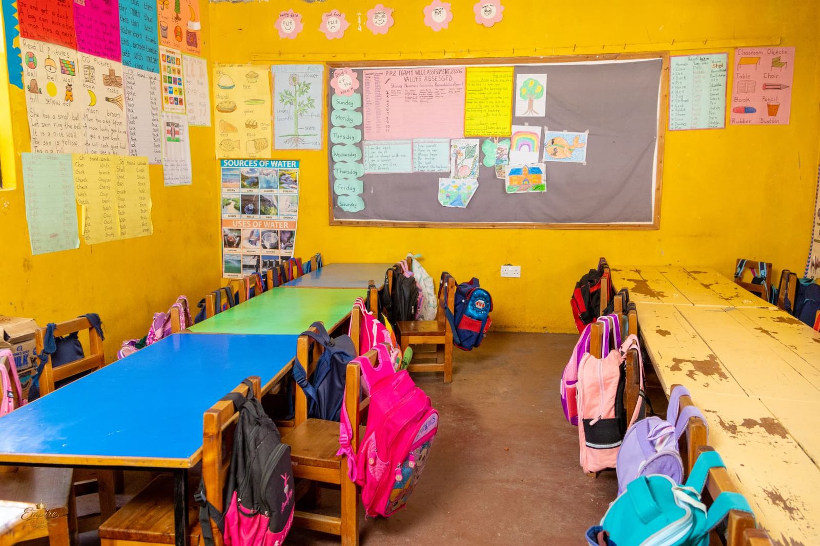 A PP2 classroom with a values chart, days of the week and learners' drawings
